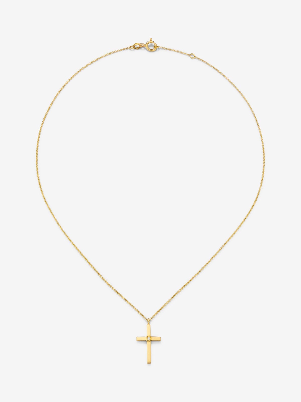 Colgante de oro amarillo de 18K con cruz grande y diamante en talla brillante de 0,015 cts