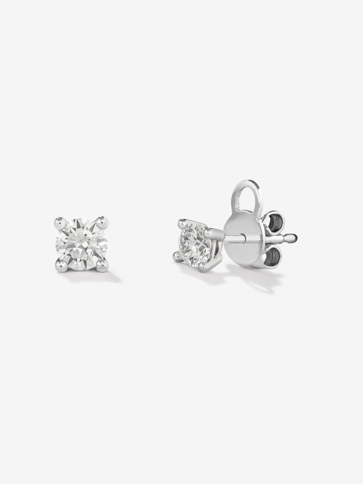 Pendientes solitarios de oro blanco de 18K con 2 diamantes en talla brillante con un total de 0,6 cts