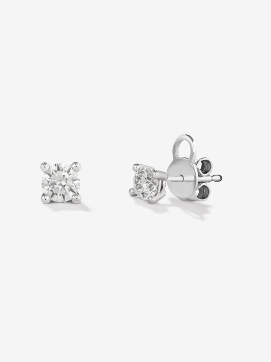 Pendientes solitarios de oro blanco de 18K con 2 diamantes en talla brillante con un total de 0,6 cts