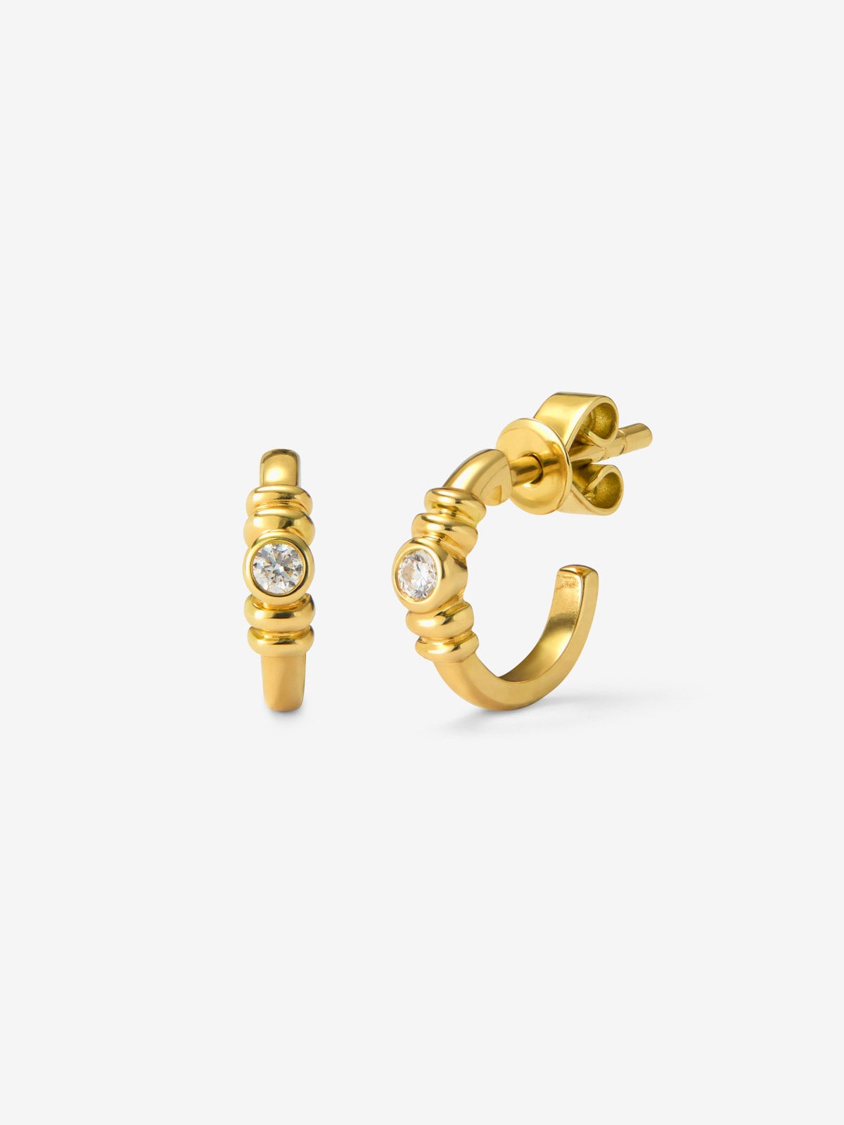 Pendientes de aro en oro amarillo de 18K con diamantes en talla brillante con un total de 0,34 cts