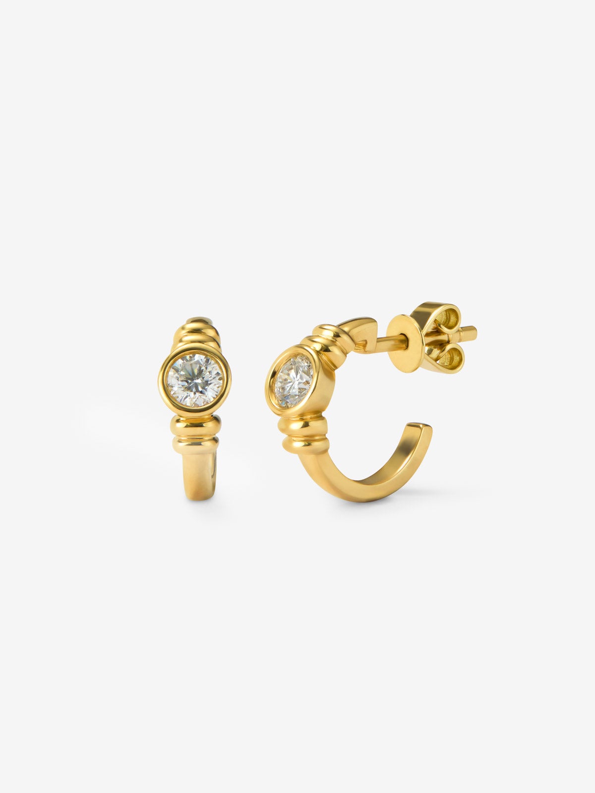 Pendientes de aro en oro amarillo de 18K con diamantes en talla brillante con un total de 0,34 cts