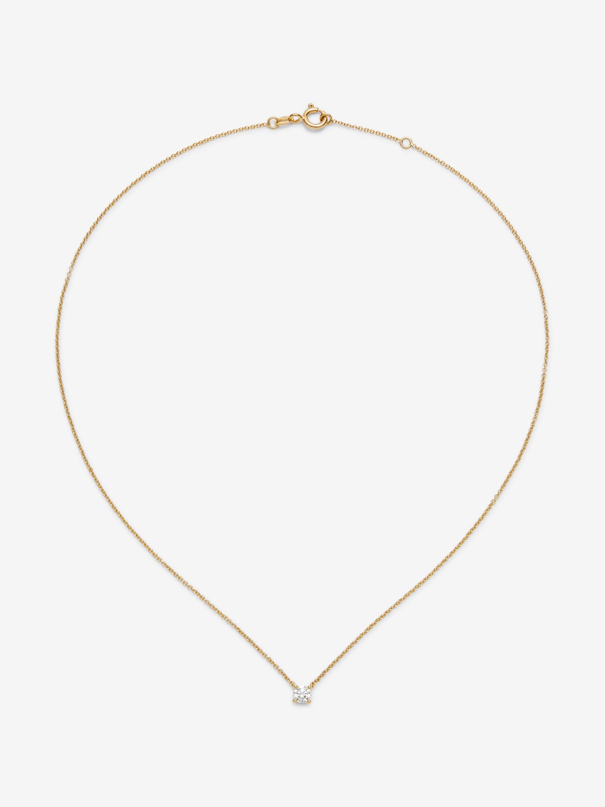 Colgante solitario de oro amarillo de 18K con diamante en talla brillante de 0,15 cts