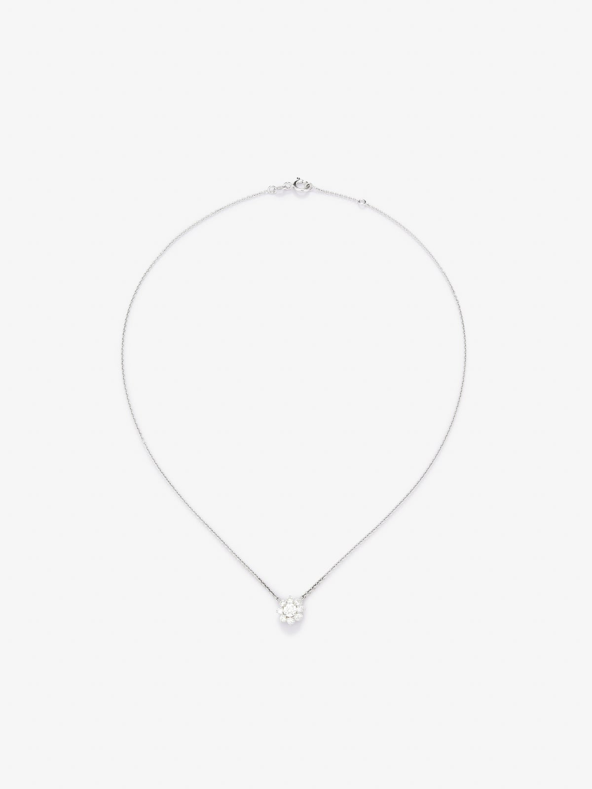 Colgante de oro blanco de 18K con diamante en talla brillante de 0,30 cts y forma de flor