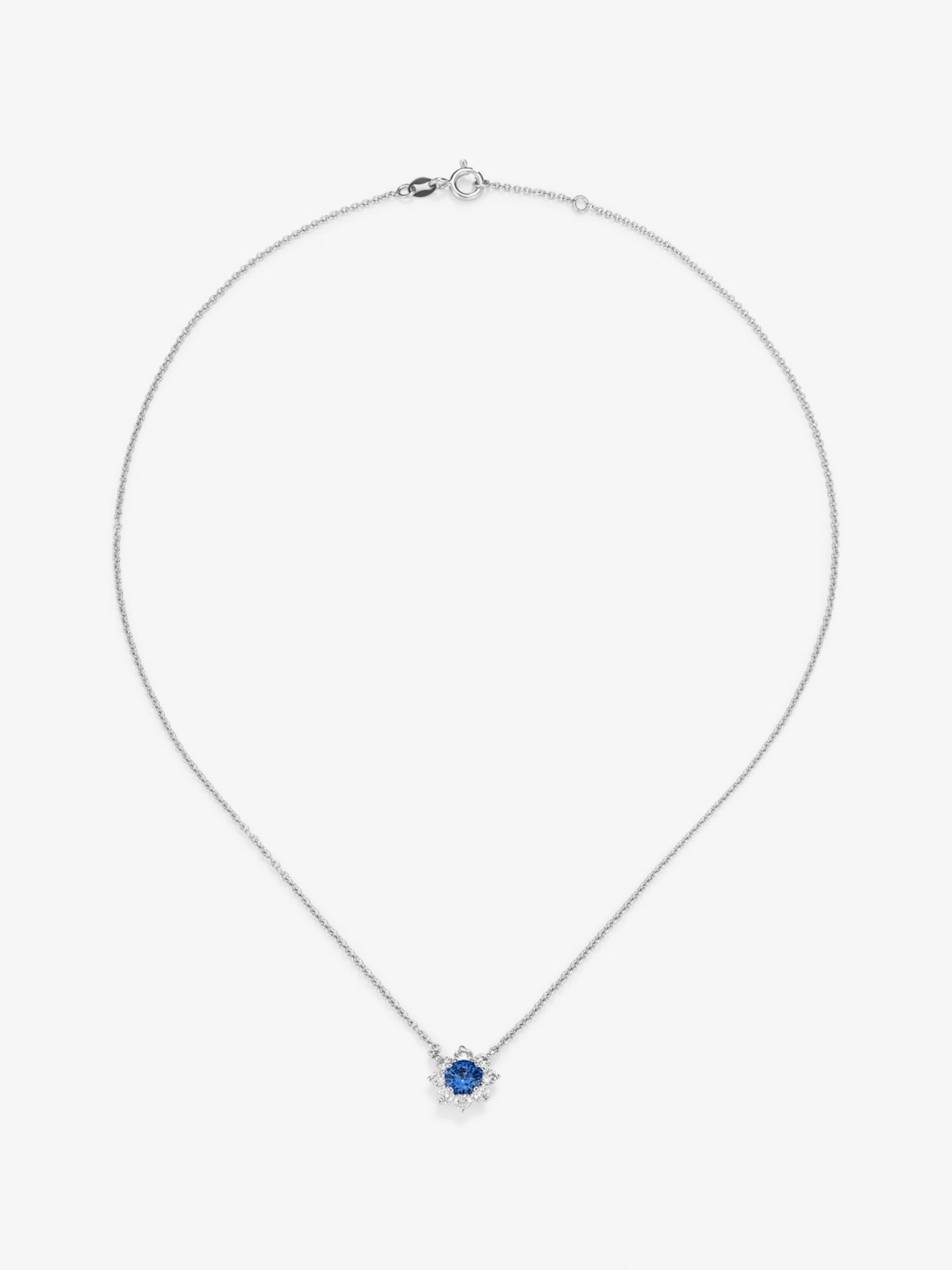 Colgante cadena flor de oro blanco de 18K con zafiro central y orla de diamantes