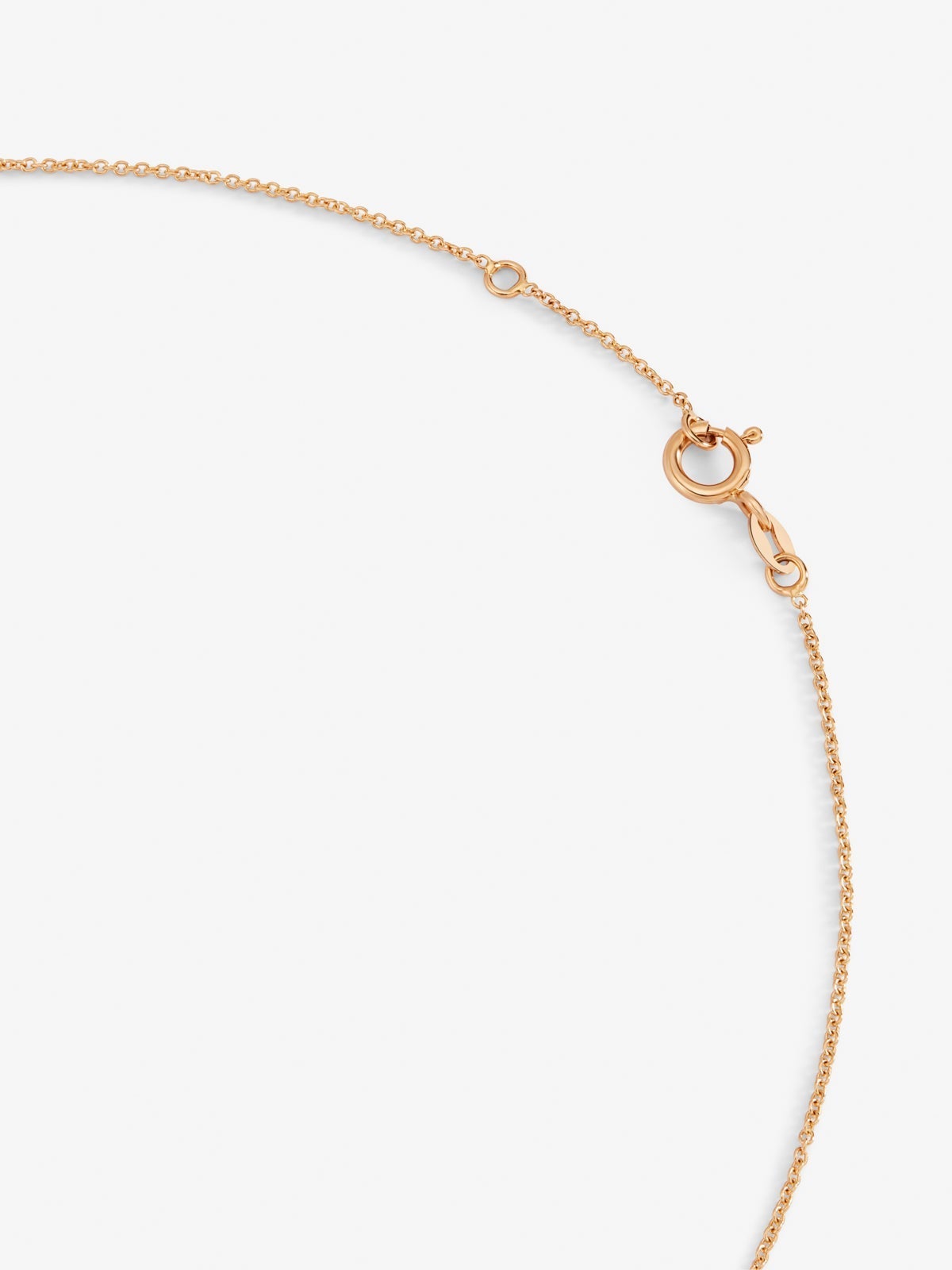 Colgante cadena cruz de oro rosa de 18K con zafiro