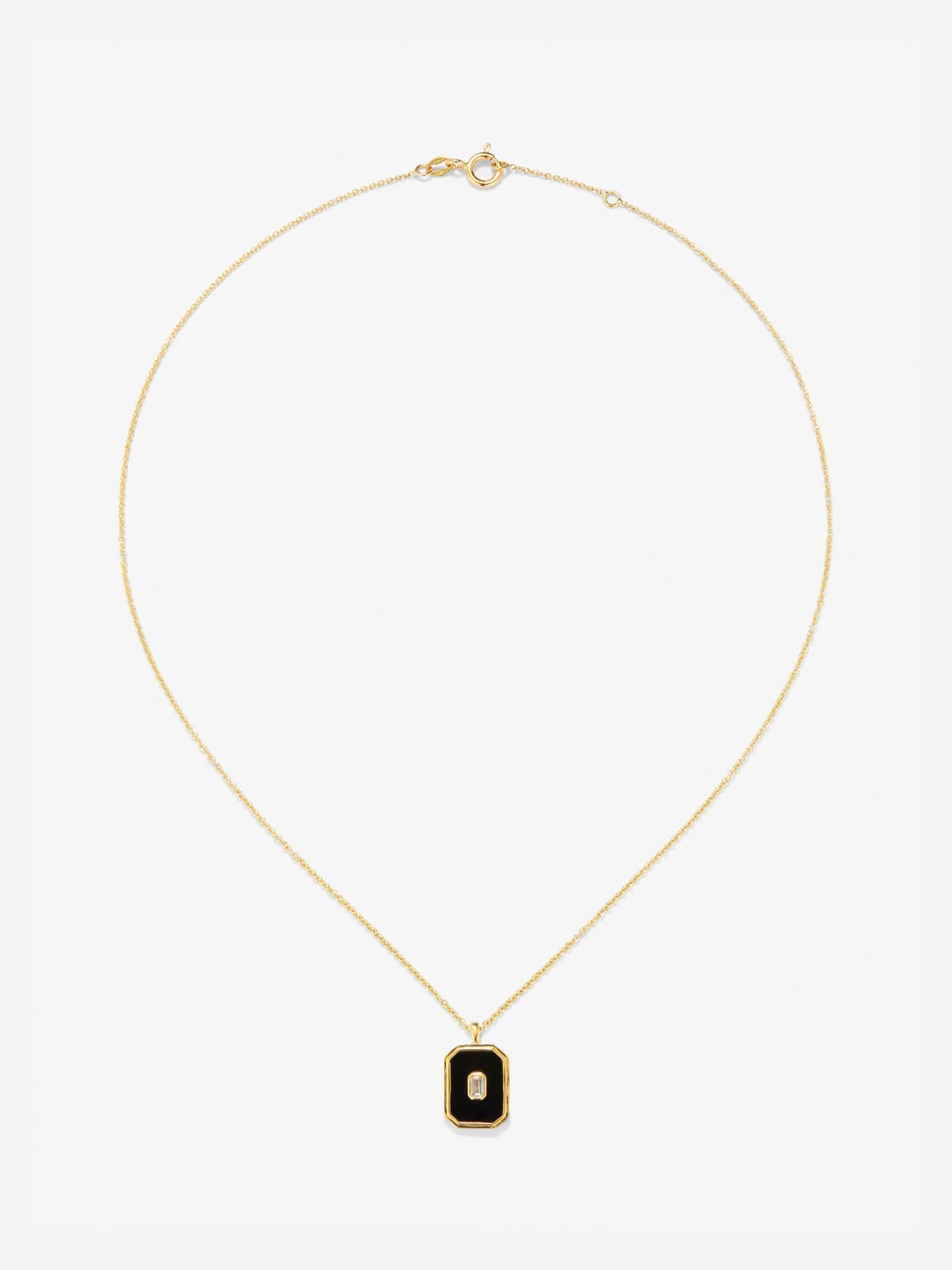 Colgante de oro amarillo de 18K con ónix negro de 1,45 cts y diamante blanco en talla esmeralda de 0,1 cts