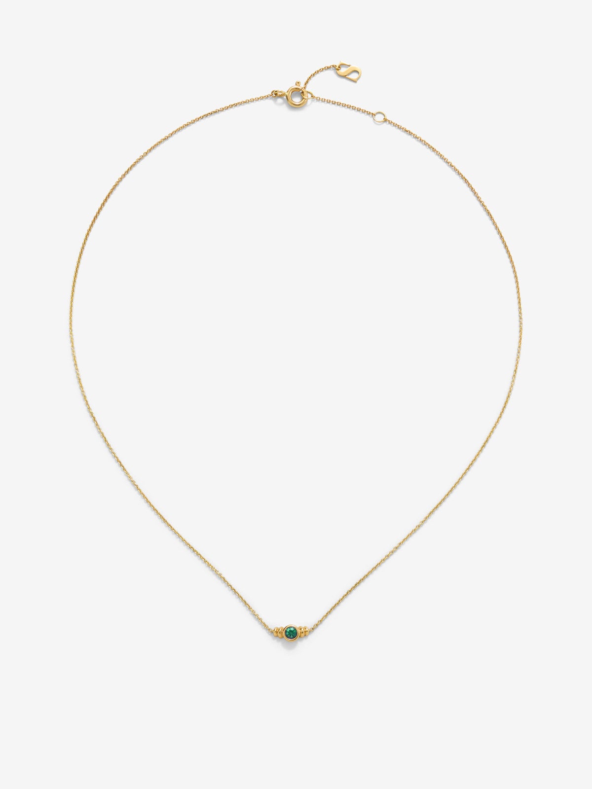 Colgante de oro amarillo de 18K con esmeralda en talla brillante de 0,1cts