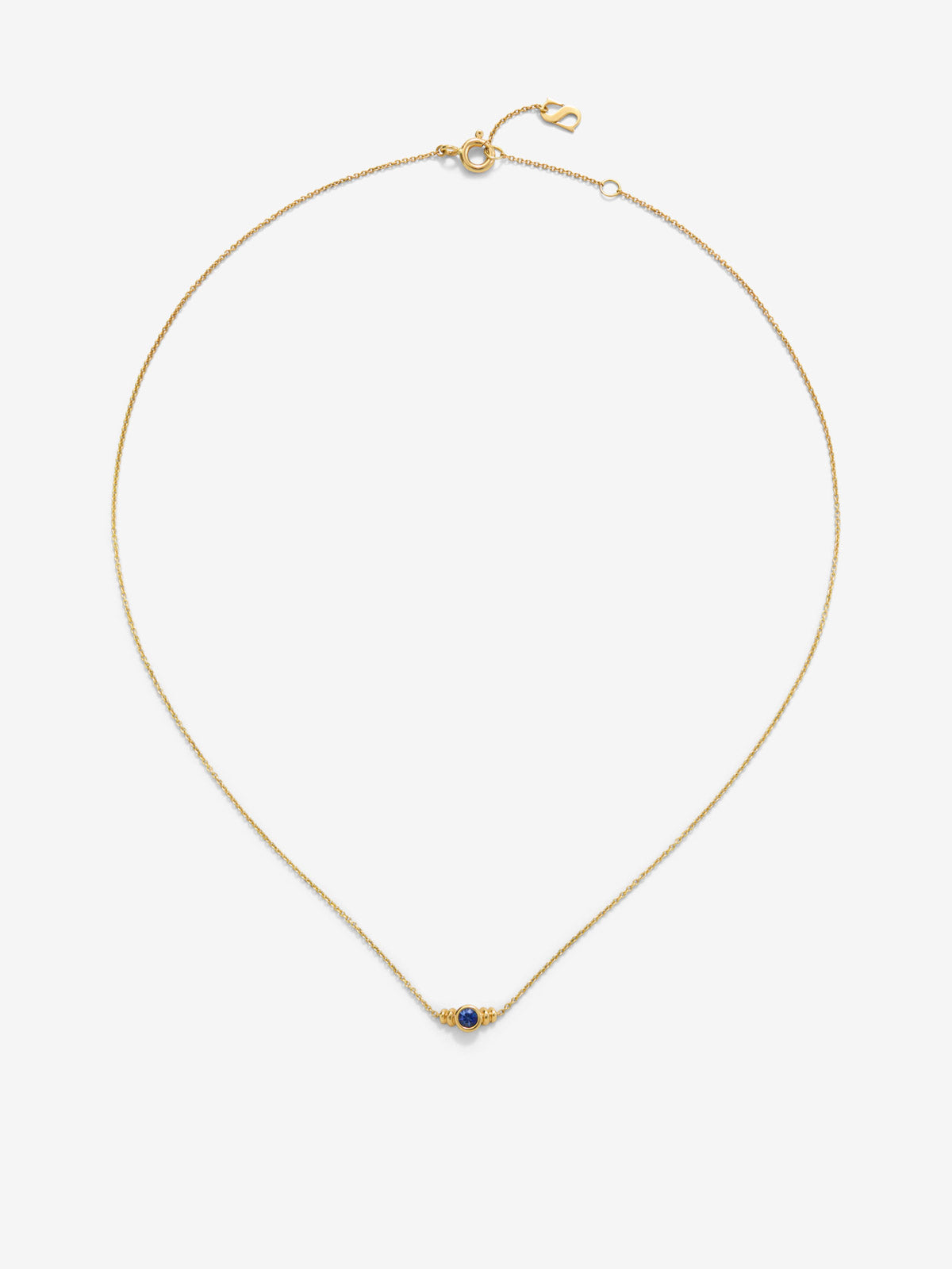 Colgante de oro amarillo de 18K con zafiro en talla brillante de 0,1cts 
