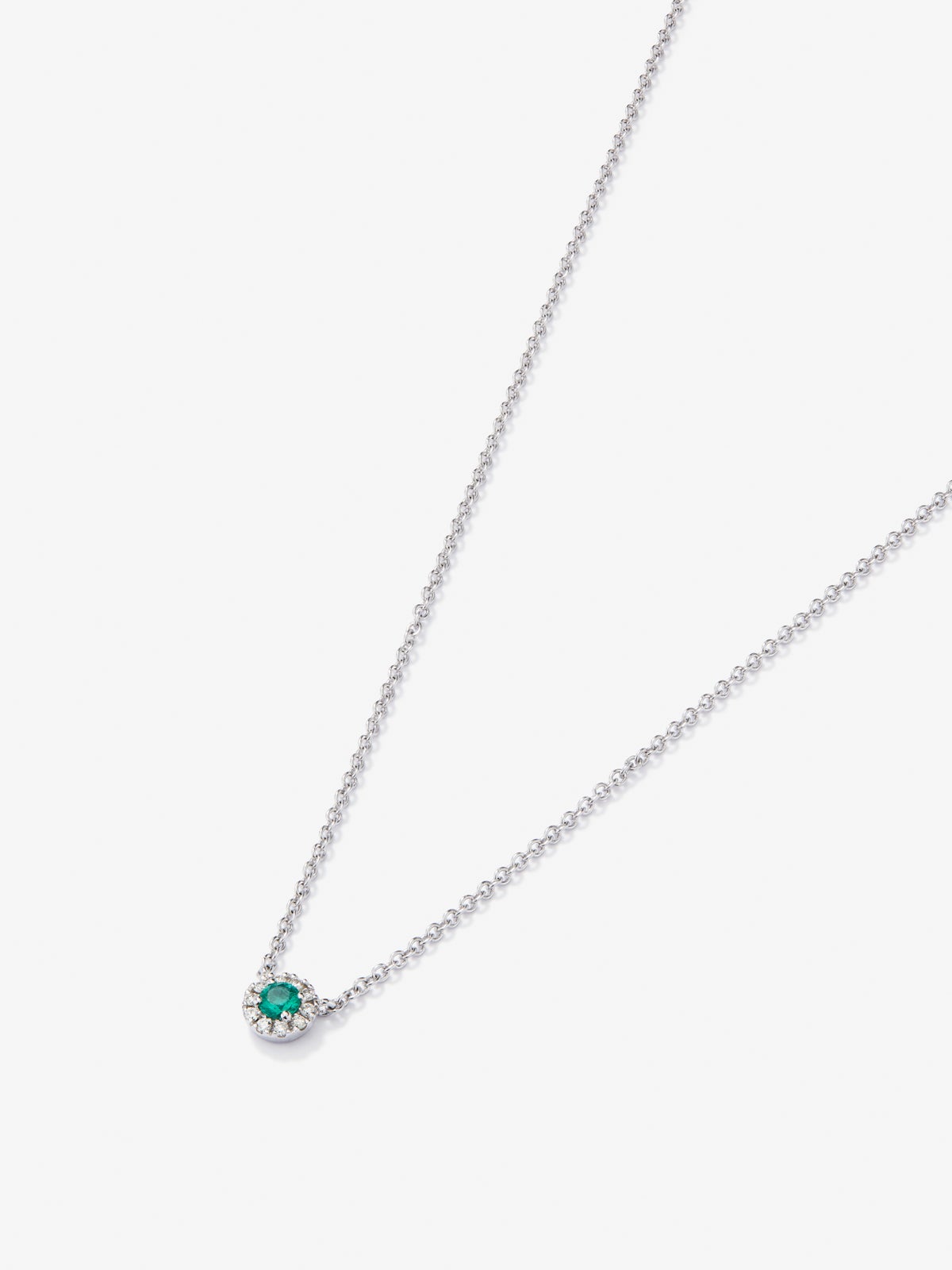 Colgante cadena orla de oro blanco de 18K con esmeralda y diamante