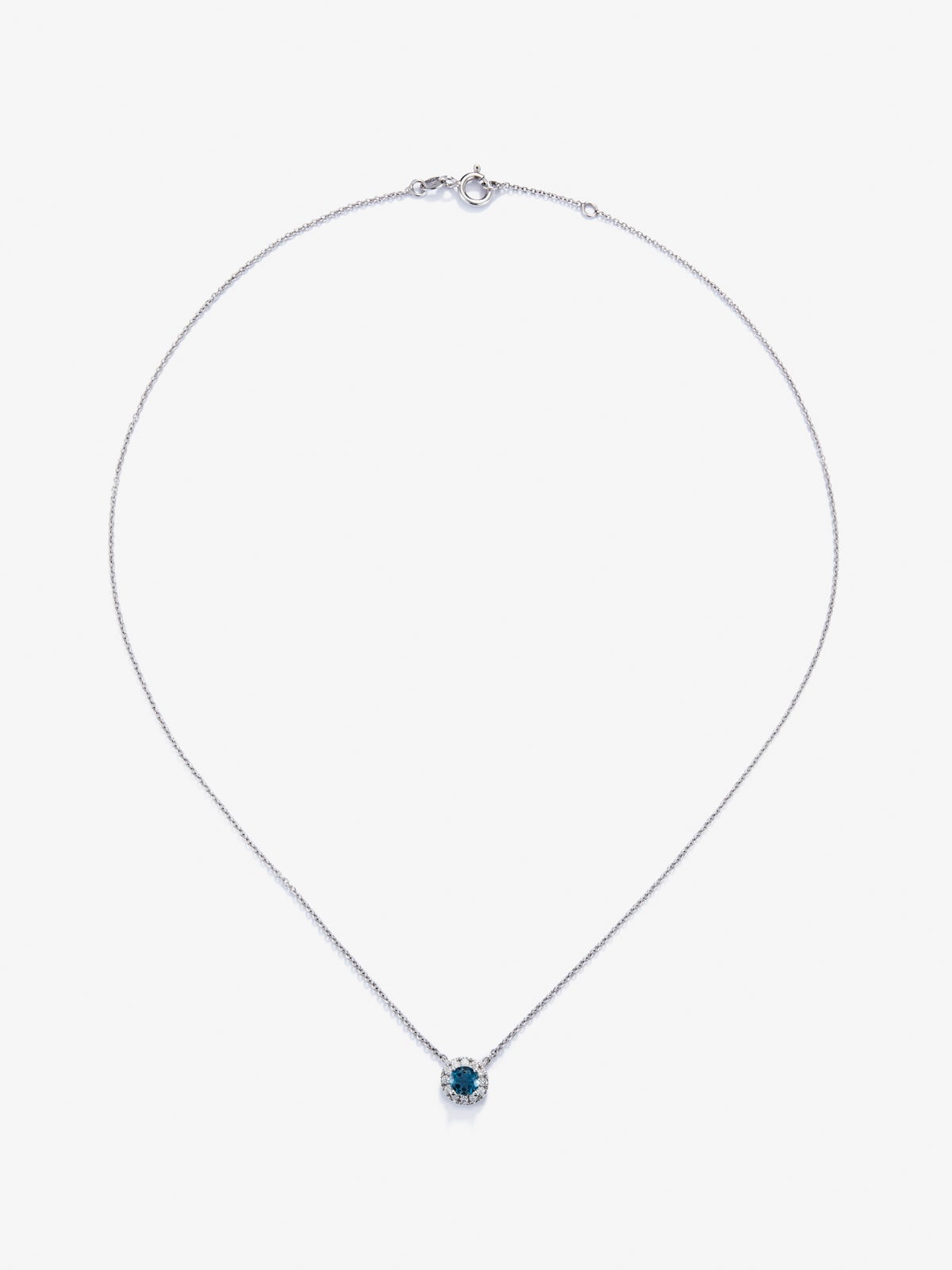 Colgante de oro blanco de 18K con topacio azul london de 0,57 cts y diamantes 0,13 cts