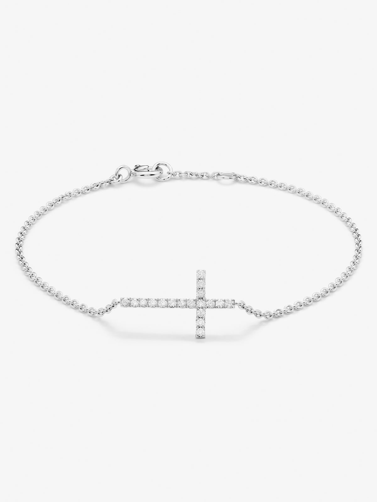 Pulsera de oro blanco de 18K con cruz de diamantes en talla brillante de 0,17 cts