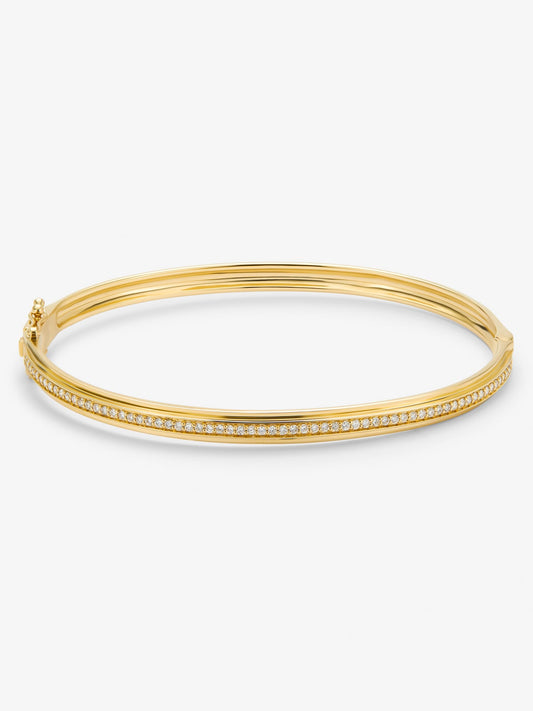 Pulsera rígida de oro amarillo de 18K con 64 diamantes en talla brillante con un total de 0,38 cts