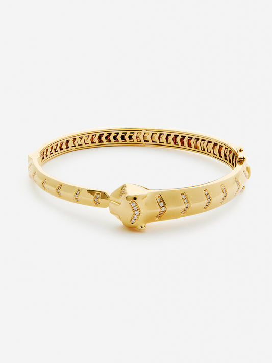 Pulsera rígida de oro amarillo de 18K con 61 diamantes en talla brillante con un total de 0,23 cts y forma de tigre