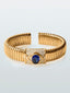 Pulsera tubogas de oro amarillo de 18K con zafiro azul royal en talla oval de 3,6 cts y 82 diamantes en talla brillante con un total de 0,1 cts