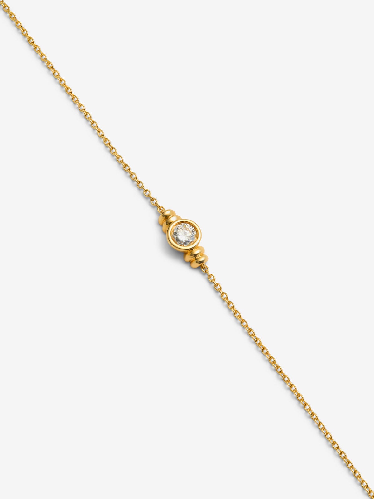 Pulsera de oro amarillo de 18K con diamante en talla brillante de 0,25 cts