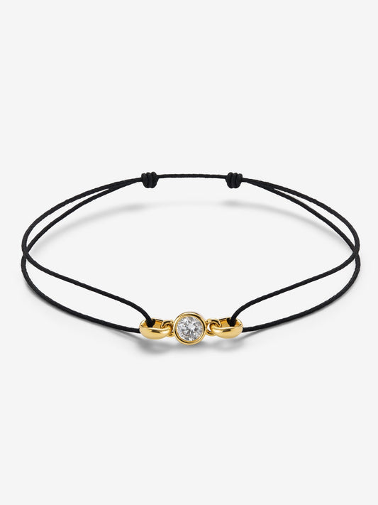 Charm de oro amarillo de 18K con diamante en talla brillante de 0,4 cts