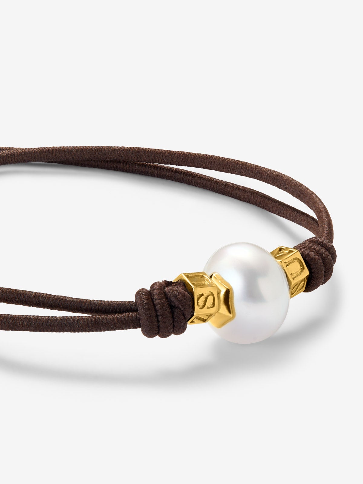 Pulsera one con perla australiana y detalles de oro amarillo de 18K