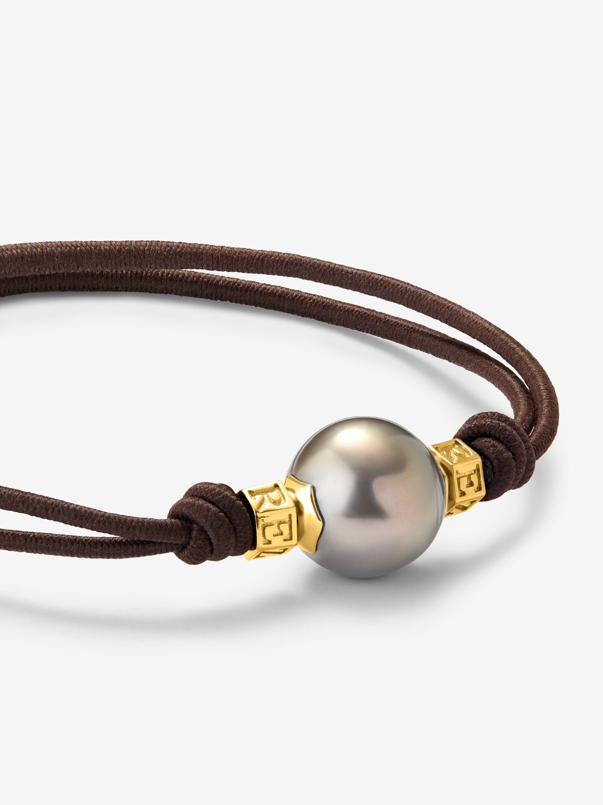 Pulsera one con perla tahití y detalles de oro amarillo de 18K