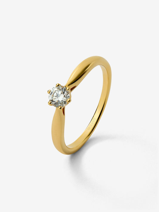 Anillo solitario de oro amarillo de 18K con diamante en talla brillante de 0,25 cts