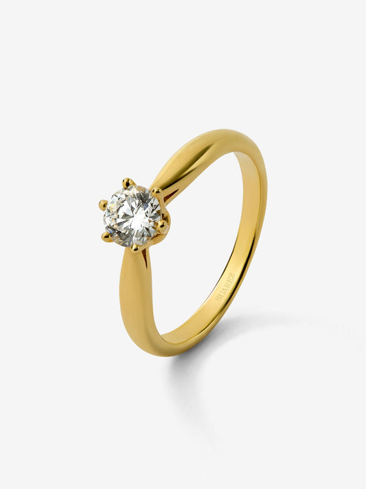Anillo solitario de oro amarillo de 18K con diamante en talla brillante de 0,3 cts
