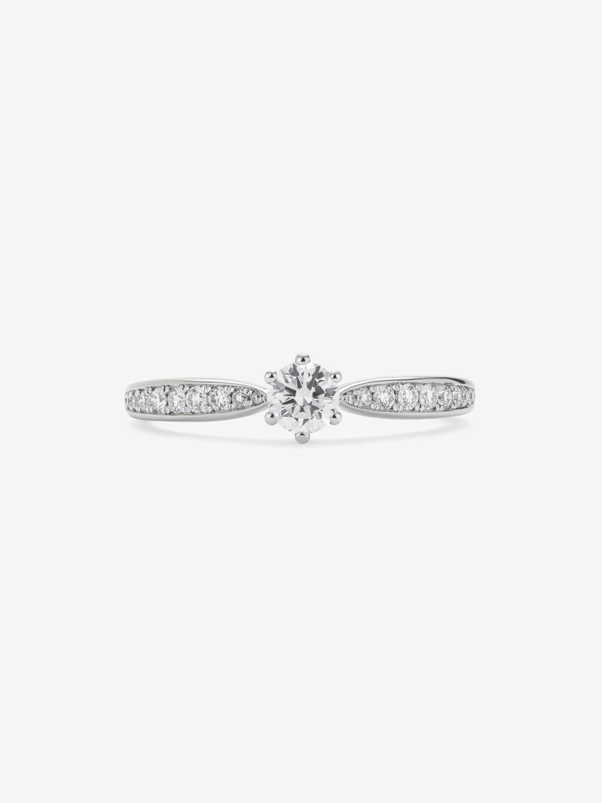 Anillo solitario 3006 de oro blanco de 18K con diamante central en talla brillante de 0,20 cts y diamantes en talla brillante con un total de 0,11 cts