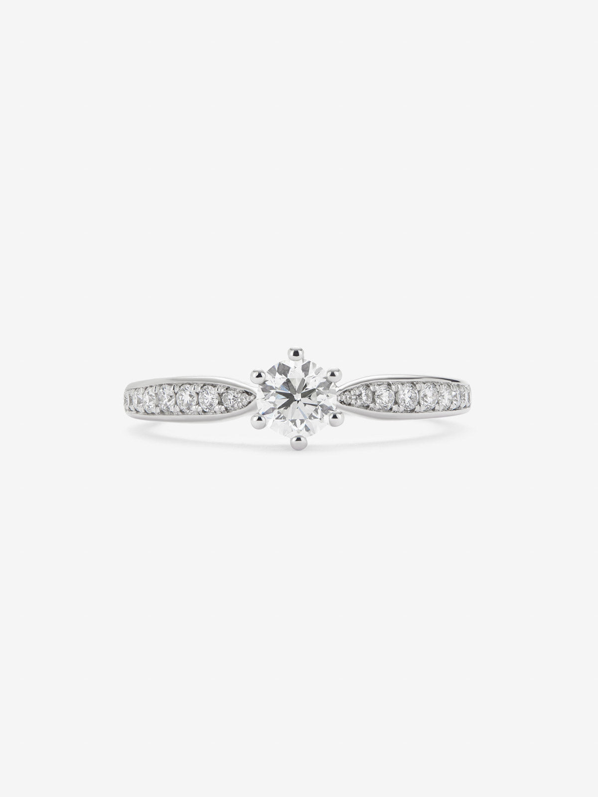 Anillo solitario 3006 de oro blanco de 18K con diamante central en talla brillante de 0,40 cts y diamantes en talla brillante con un total de 0,19 cts