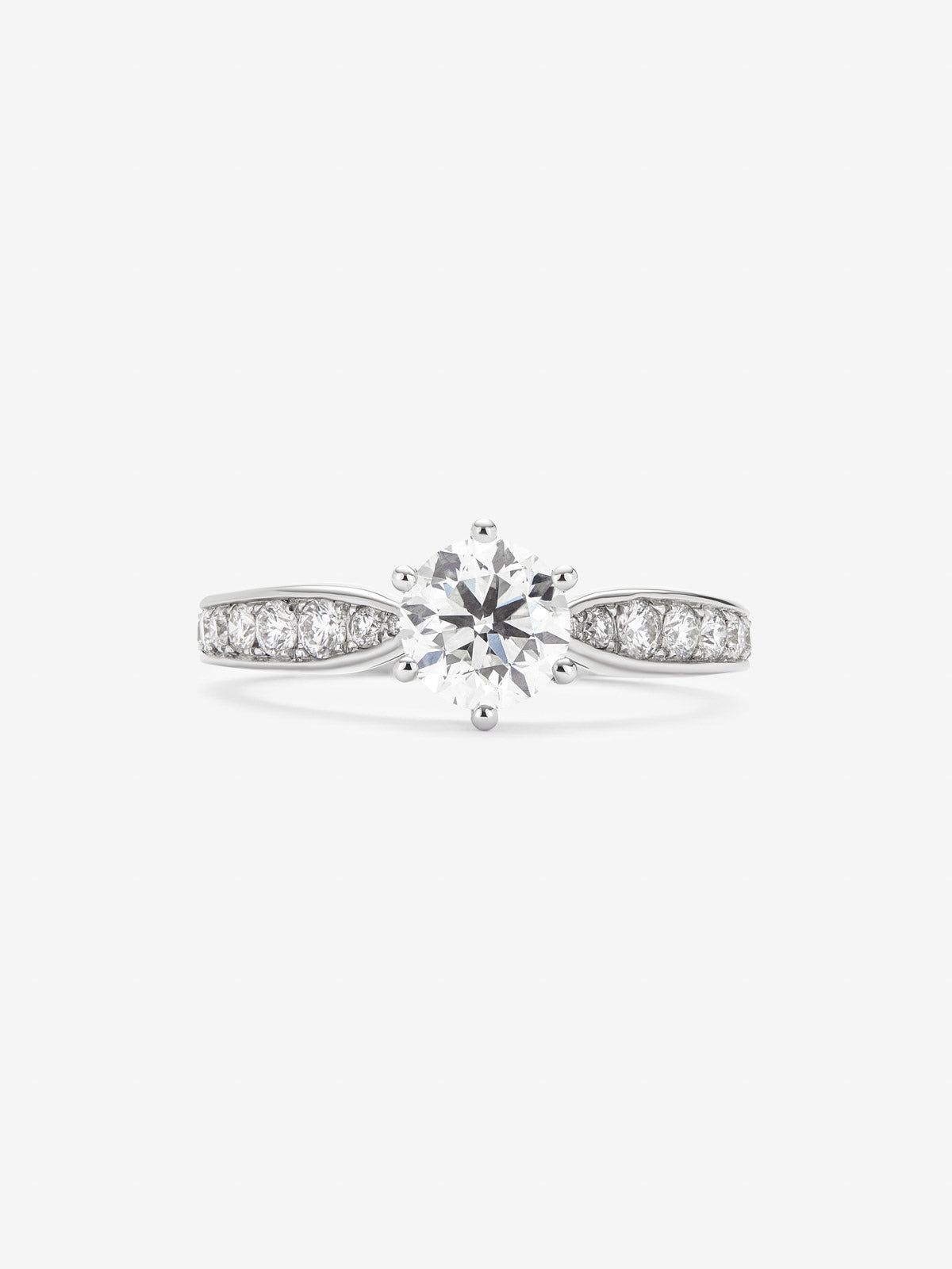 Solitaire ring in 18K white gold with a 1-carat brilliant-cut central diamond and additional diamonds totaling 0.38 cts
