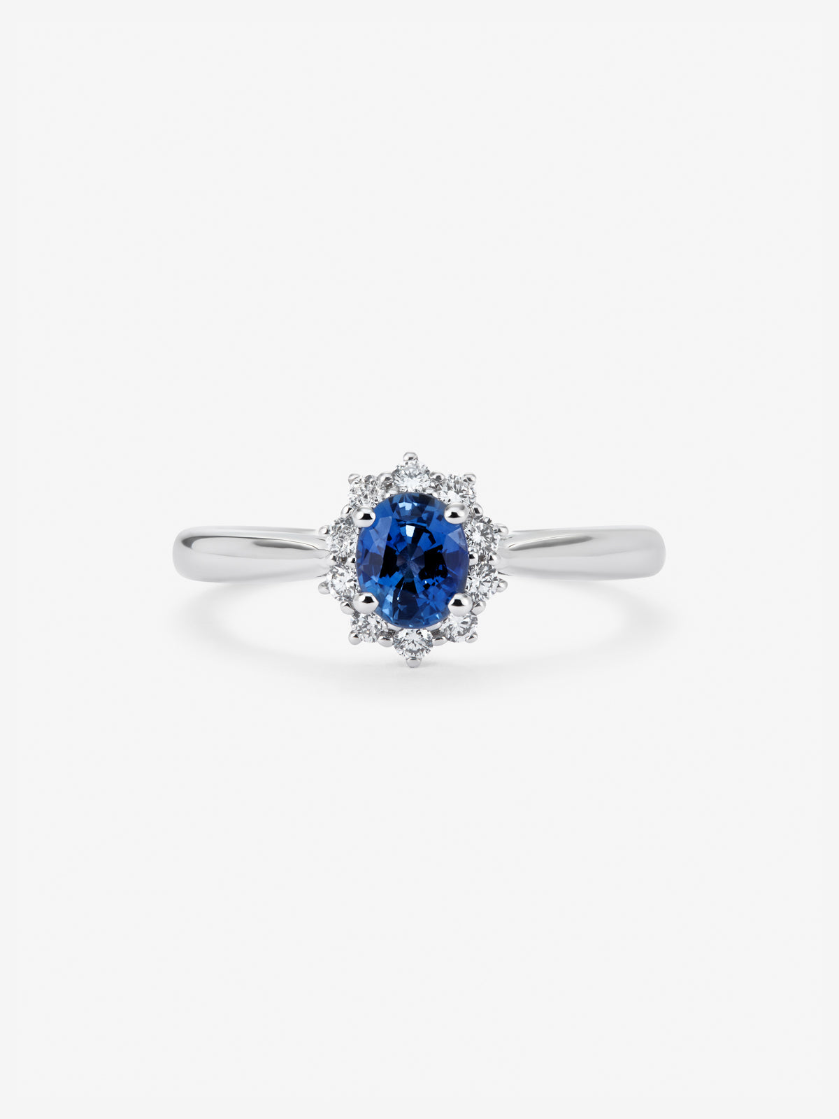 Anillo de oro blanco de 18K con zafiro azul 0,30 cts y diamantes 0,12 cts