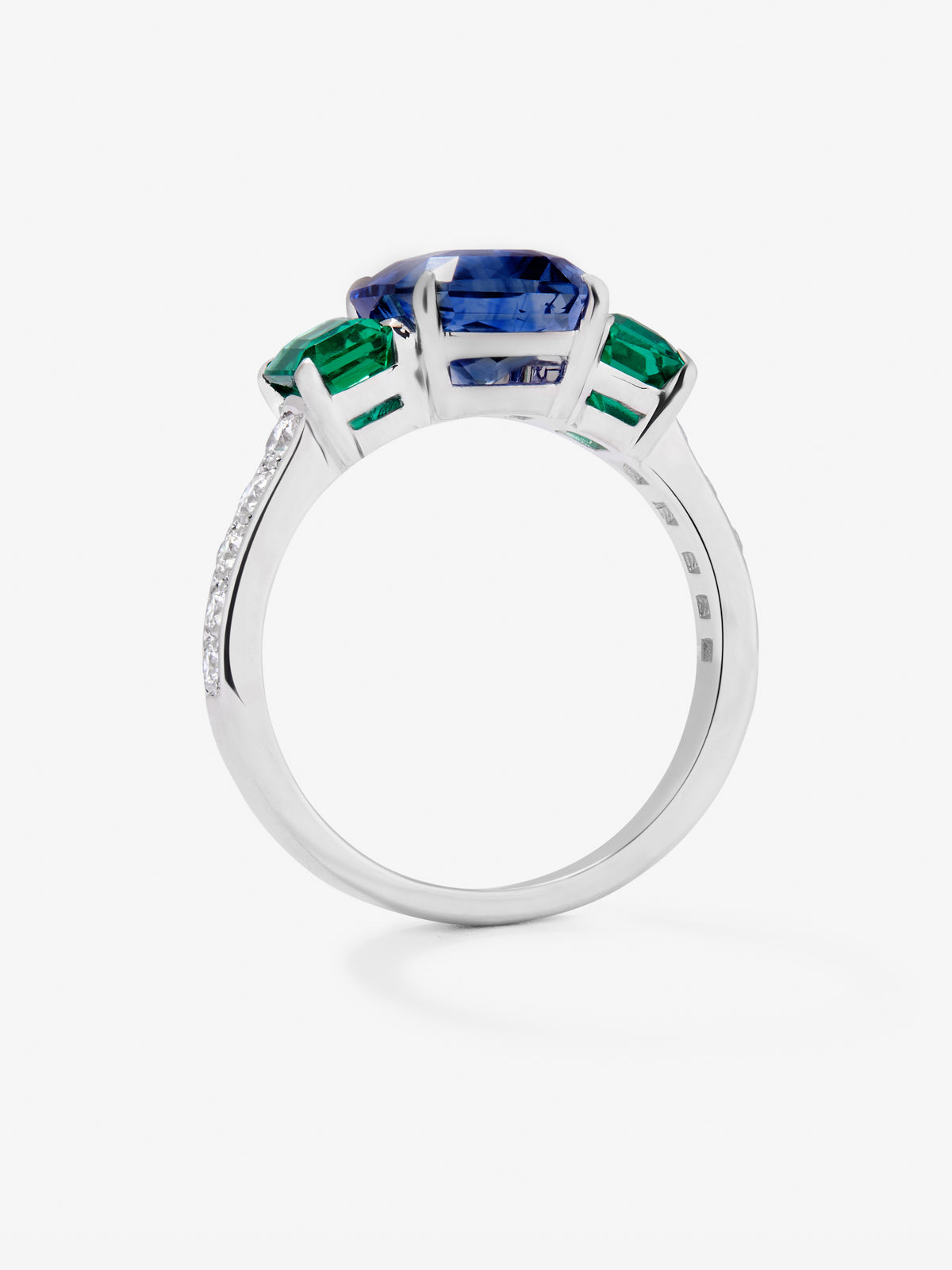 18K White Golden Tieillo Ring with blue sapphire in 3.6 cts, green emeralds in octagonal size 1.12 cts and white diamonds in bright size of 0.073 cts