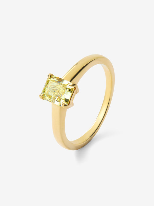 Anillo solitario de oro amarillo de 18K con diamante central Fancy Yellow en talla radiant de 1,06 cts