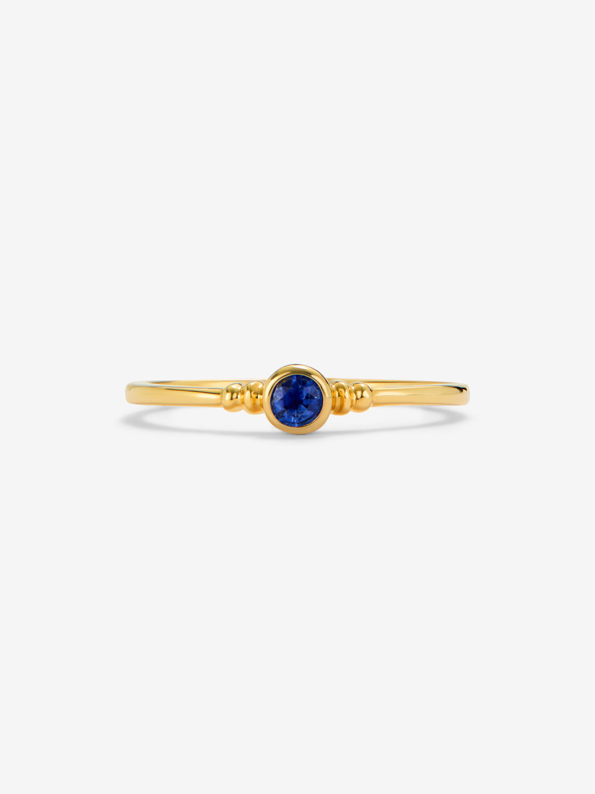 Anillo de oro amarillo de 18K con zafiro azul en talla brillante de 0,12 cts