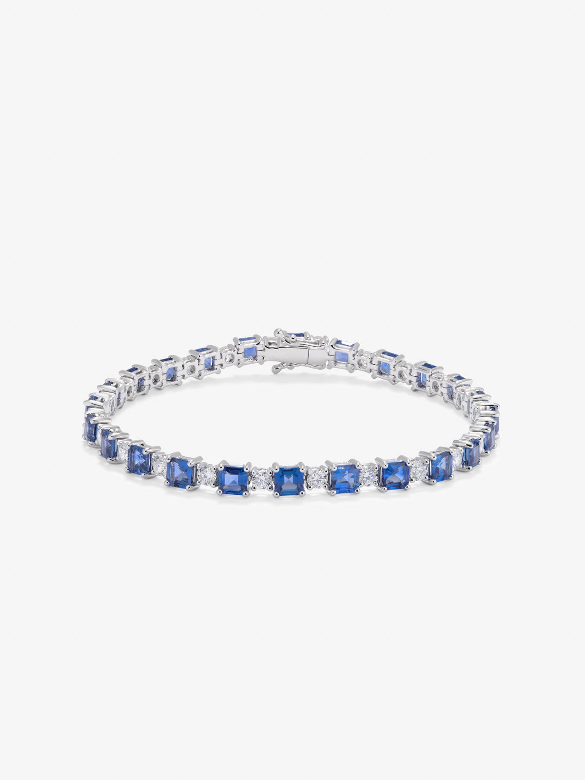 18K white gold rivière bracelet with 9.97 ct octagonal-cut blue sapphires and 2.63 ct brilliant-cut diamonds