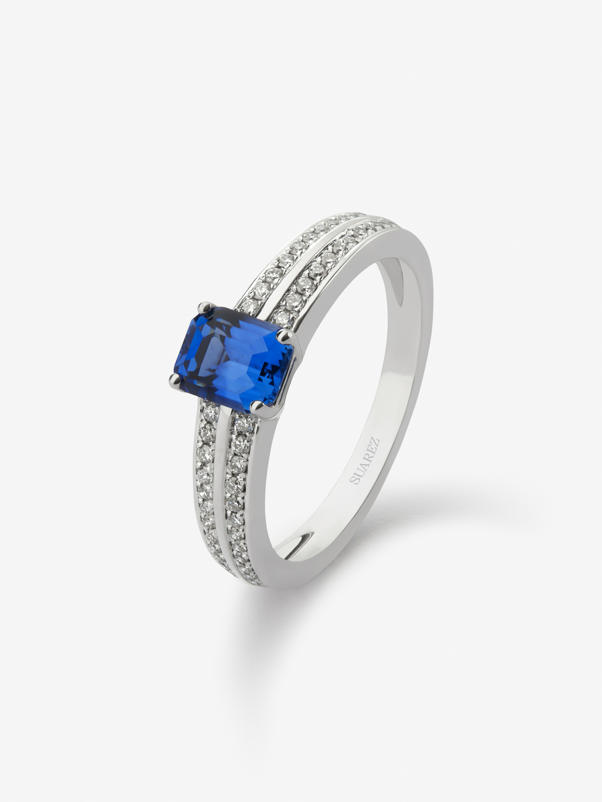 18K white gold ring with vivid blue sapphire in octagonal cut of 1.09 cts and 52 brilliant-cut diamonds with a total of 0.18 cts